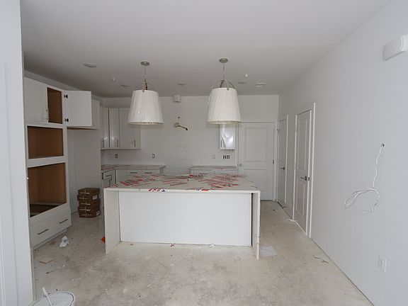 Upgraded kitchen under construction with partial finishes