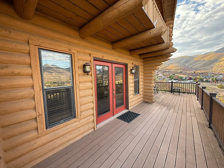 North side of main floor deck, showing French doors to family room