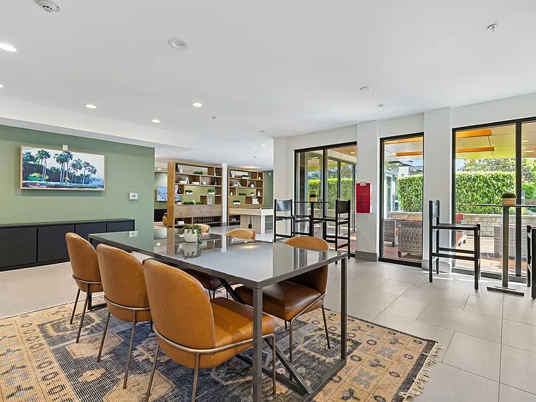 Gather friends around the dining table for a shared meal in the resident lounge
