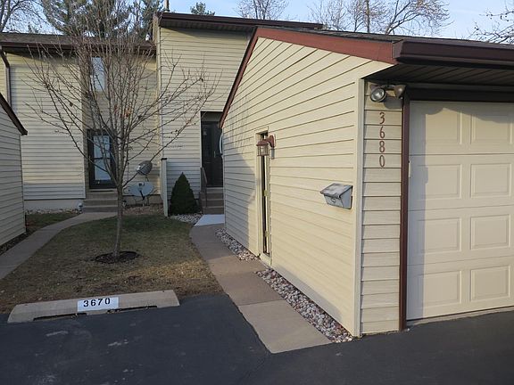 Detached one car garage and additional parking spaces