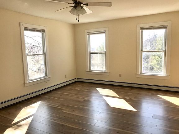 Living room with 4 large windows, 2 full size closets.