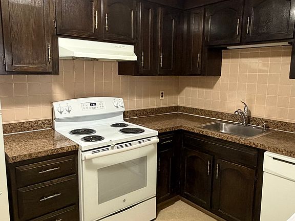 Kitchen with electric Stove, Fridge and dishwasher