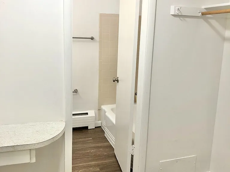 Step into elegance with a chic bathroom entrance and ample closet space. Step into elegance with a chic bathroom entrance and ample closet space.