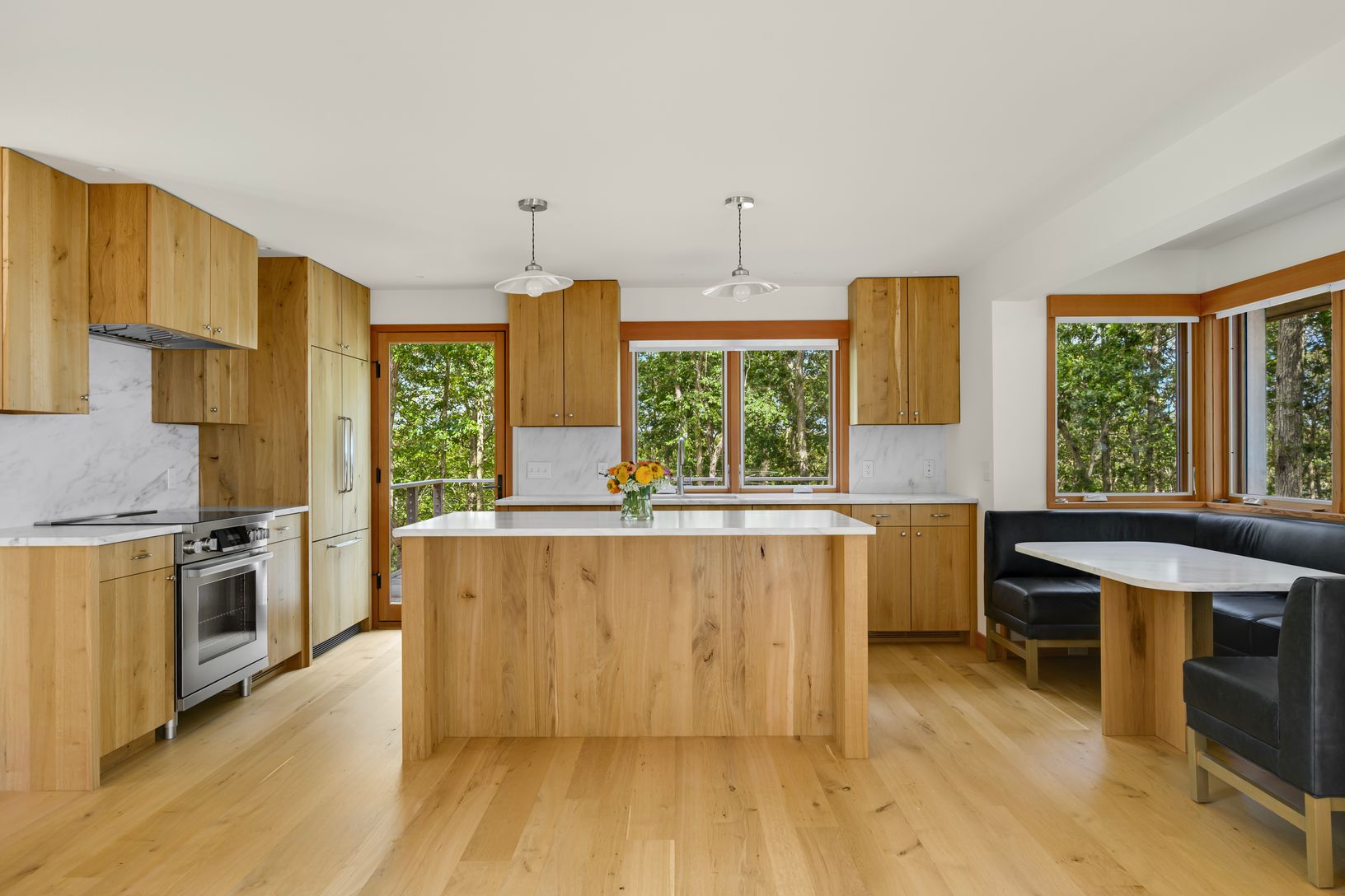  Chefs Kitchen with custom wood cabinetry, leathered stone counters and high end appliances