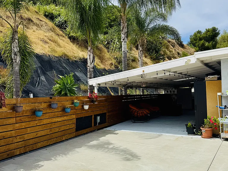 view from open yard area to covered patio