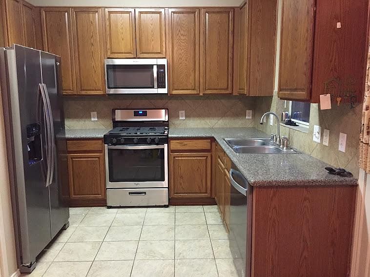 year old appliance tile floor kitchen and breakfast place