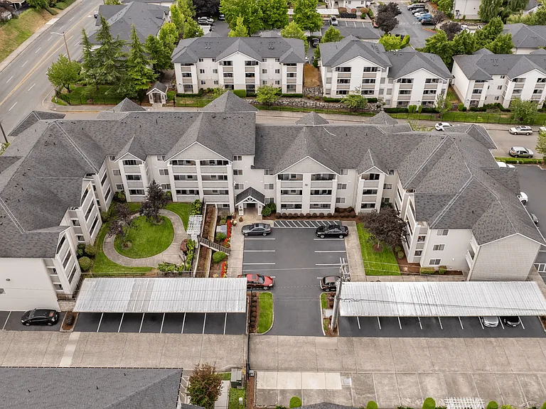 Spacious community layout with landscaped grounds and convenient parking.