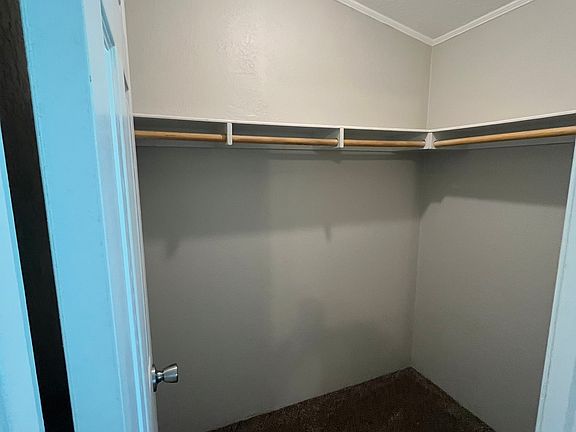 walk in closet in primary bedroom