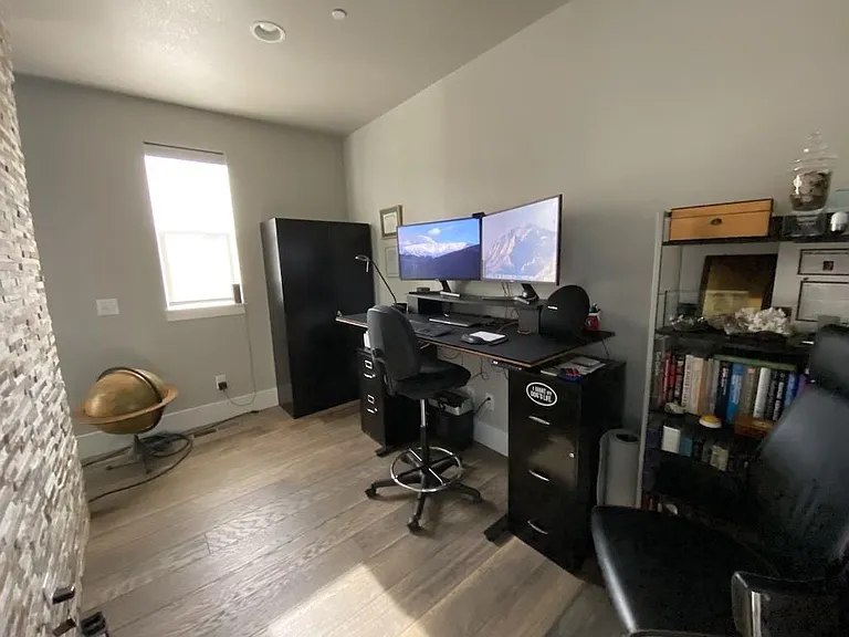 Office with dual monitors, camera for Zoom calls