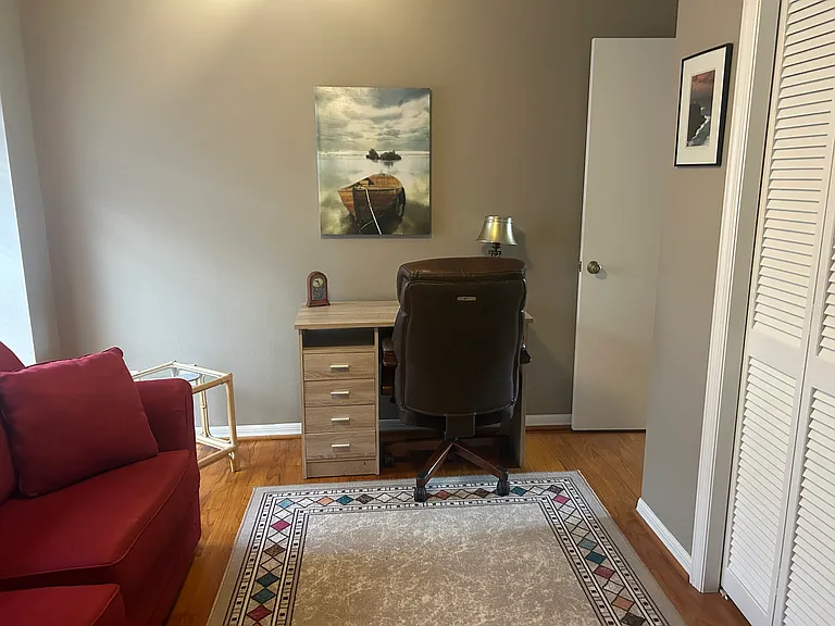 Spare bedroom with desk and chair