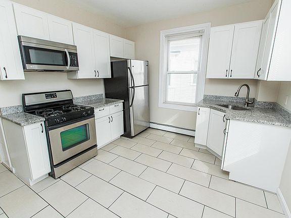 Kitchen with granite countertops and stainless steel appliances.