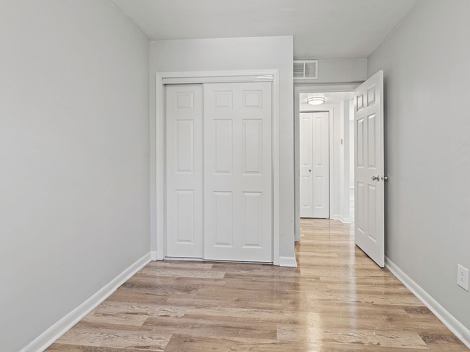 Step into a serene space with elegant finishes and seamless storage solutions.