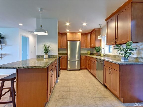 Stainless steel appliances are just 2 years old. Generous granite countertops, ample storage, tile floor.