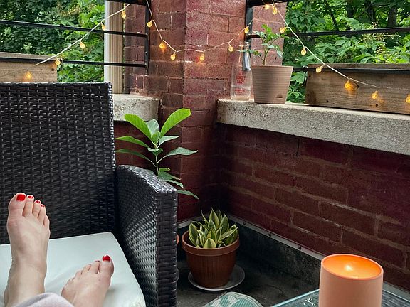 Quiet, tree-lined balcony is perfect for reading, morning coffee, or evening drinks!