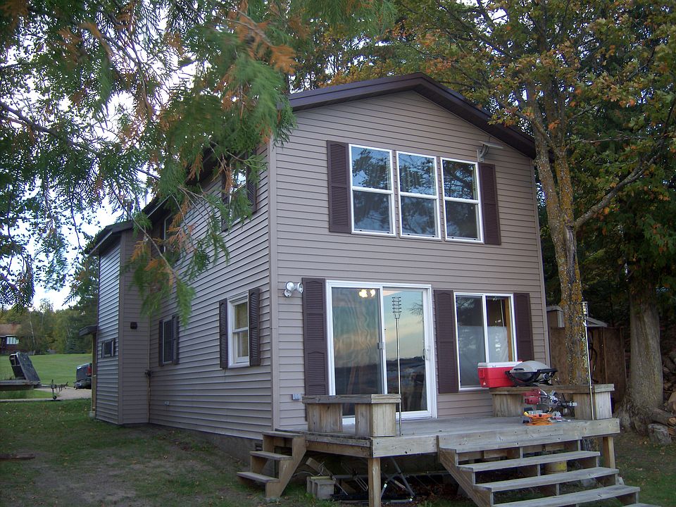 front of cabin facing lake