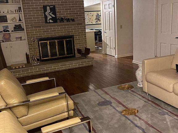 Formal living room with a wood burning fireplace. This room is so cozy in the winter.