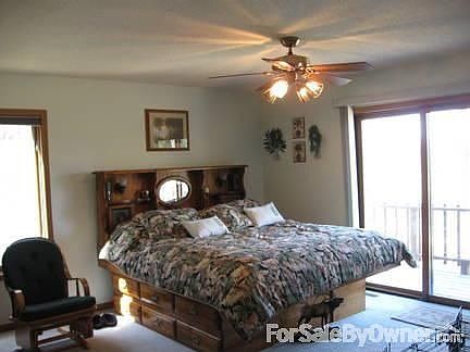 Spacious main floor master bedroom.
						:
						King size bed and step in closet with room for large dressers and book cases.