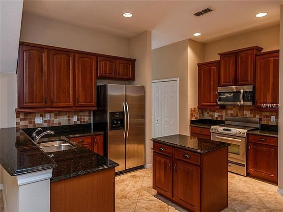 Kitchen with Granite Countertops. 42" Cabinets and Center Island