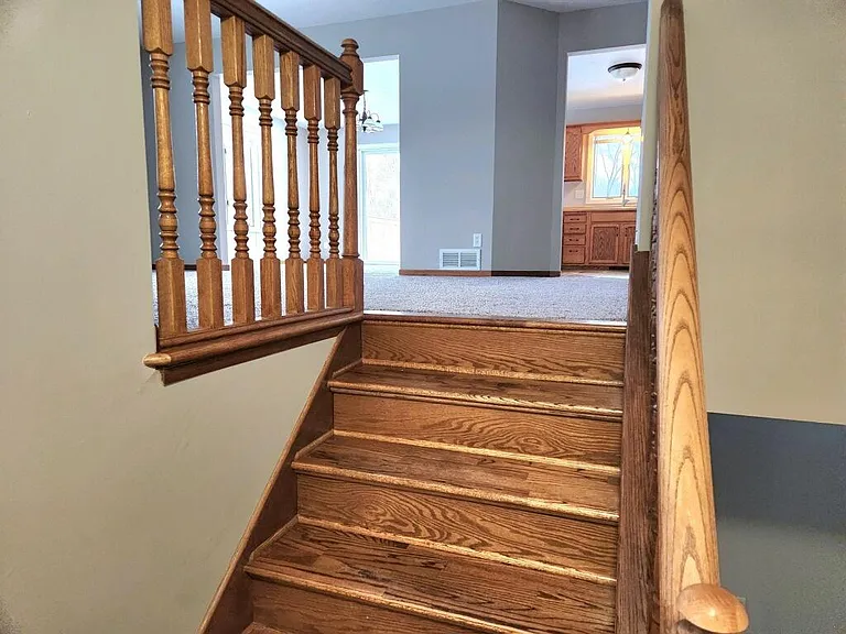 Split entry home. Three bedrooms and full bathroom upstairs. Large family room, office, laundry room, and second bathroom downstairs.