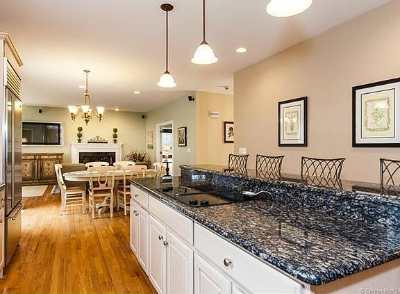 Kitchen allows for you to cook on the center island while conversing with family and friends sitting at the bar.