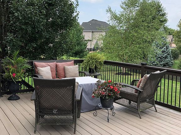 Enjoy outdoor entertaining on this huge deck w/iron balusters~Deck has just been re-stained!