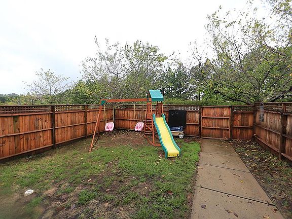 Fenced back yard, perfect play area for kids and pets