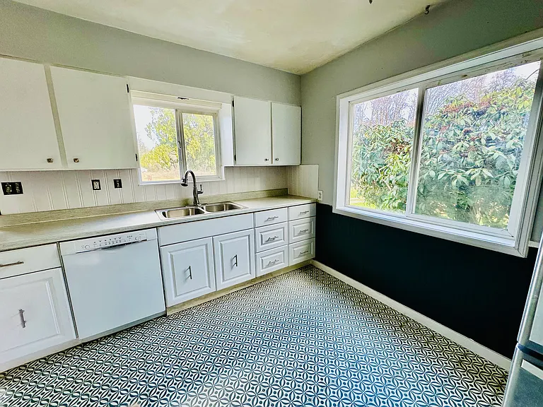 New paint cabinets fixtures and flooring though out the house.