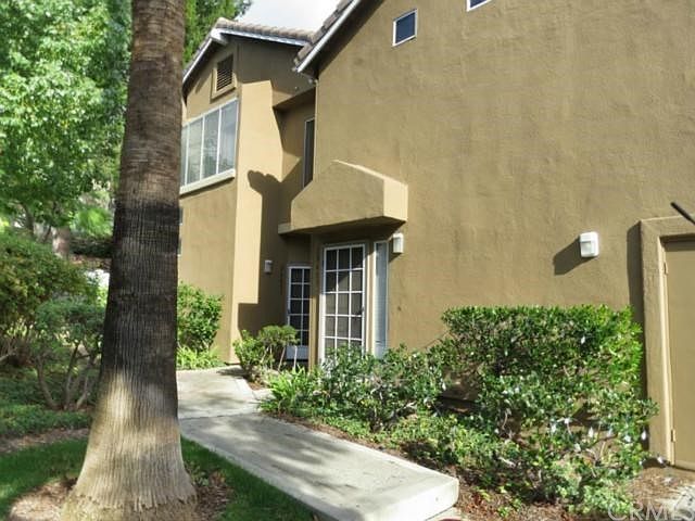 The condo is an end unit in the back. It borders the stree