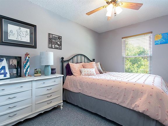 Impressive brick fireplace with mantle is the focal point for the great room with vaulted ceiling... There's plenty of room here