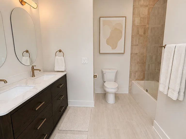 Jack & Jill Bath- Double sink vanity and tile by Edward Martin.