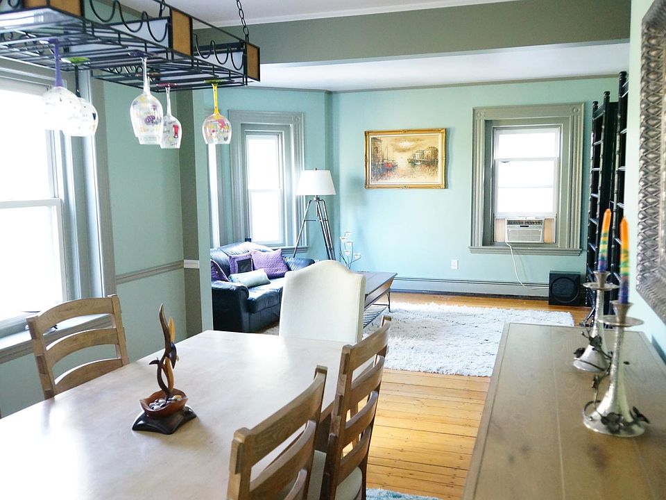 A spacious open floor plan living/dining area includes six windows with multiple exposures which provide an abundance of natural light. 9' ceilings throughout add to the grandeur.