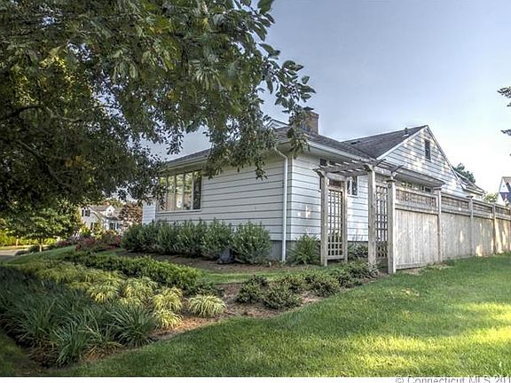 Gorgeous Landscaping including a Beautiful Arbor and Privacy Fence