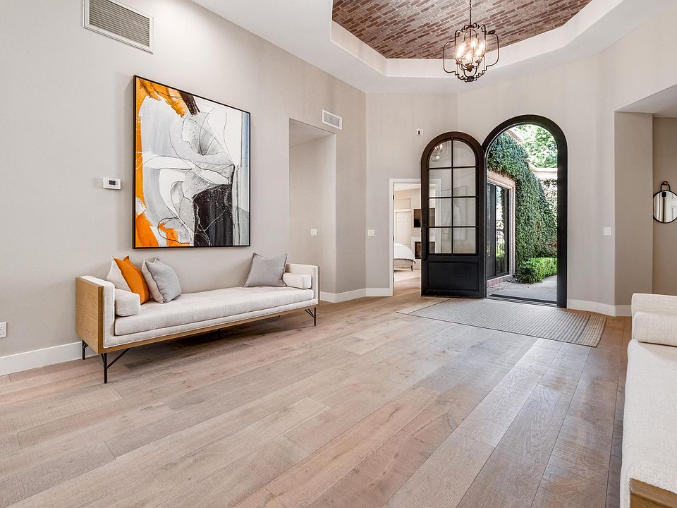 Incredible 55"x70" original canvas paintings (privately commissioned to coordinate with each other and SO much prettier in person) and the most stunning daybeds from Scottsdale's Bungalow boutique flank the dramatic entry way.