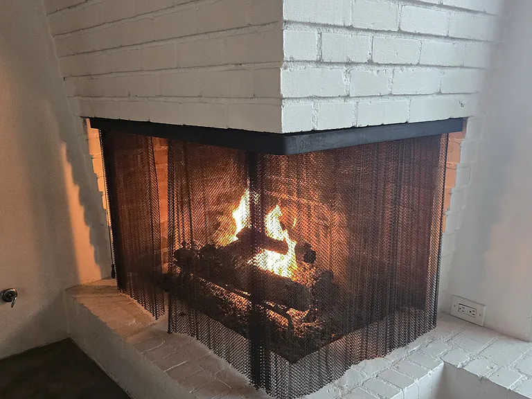 The original mid-century gas fireplace, a timeless architectural centerpiece.