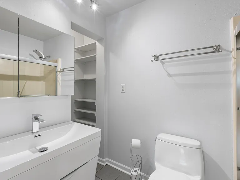 Master Bathroom with Two Walls of Shelves