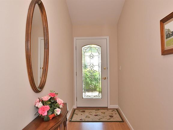 The entry door features custom leaded glass!