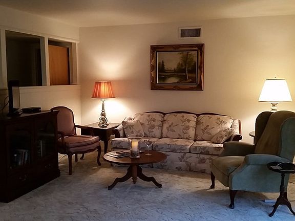 NICE OPEN LIVING ROOM. ON THE LEFT IS HALL TO BED