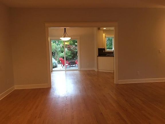 LIving room and dining area, view to backyard