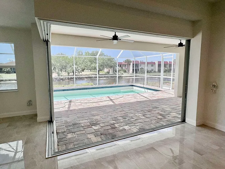 View on the pool with open slide door