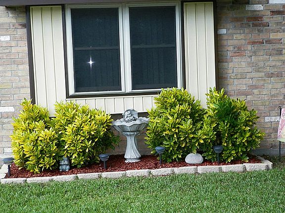 Tidy easy to maintain landscaping. Fountain, rocks and lights stay.