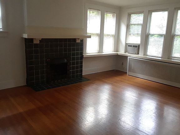 This is the actual living room (with extra window on left). Tall ceilings not shown (see first photo - reverse apt.)