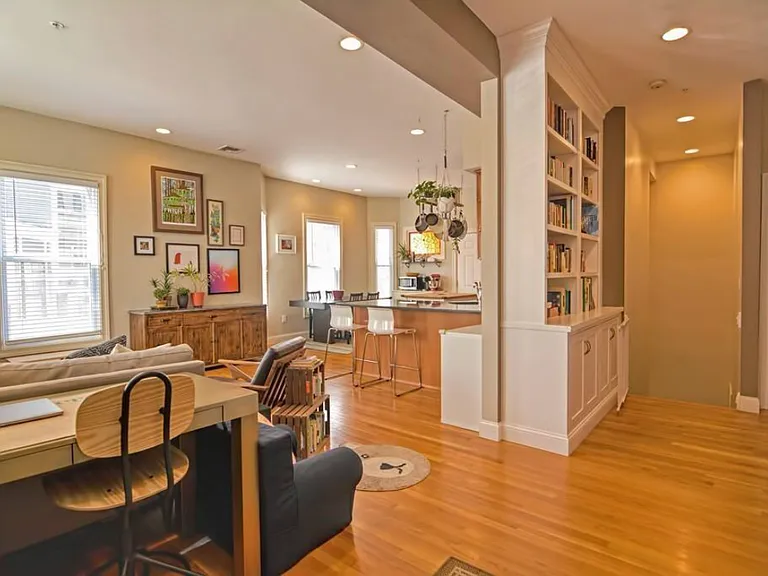 Entry facing living room and to lower floor.