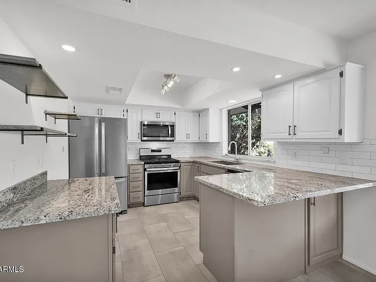 Spacious gourmet kitchen. Overlooks the backyard.