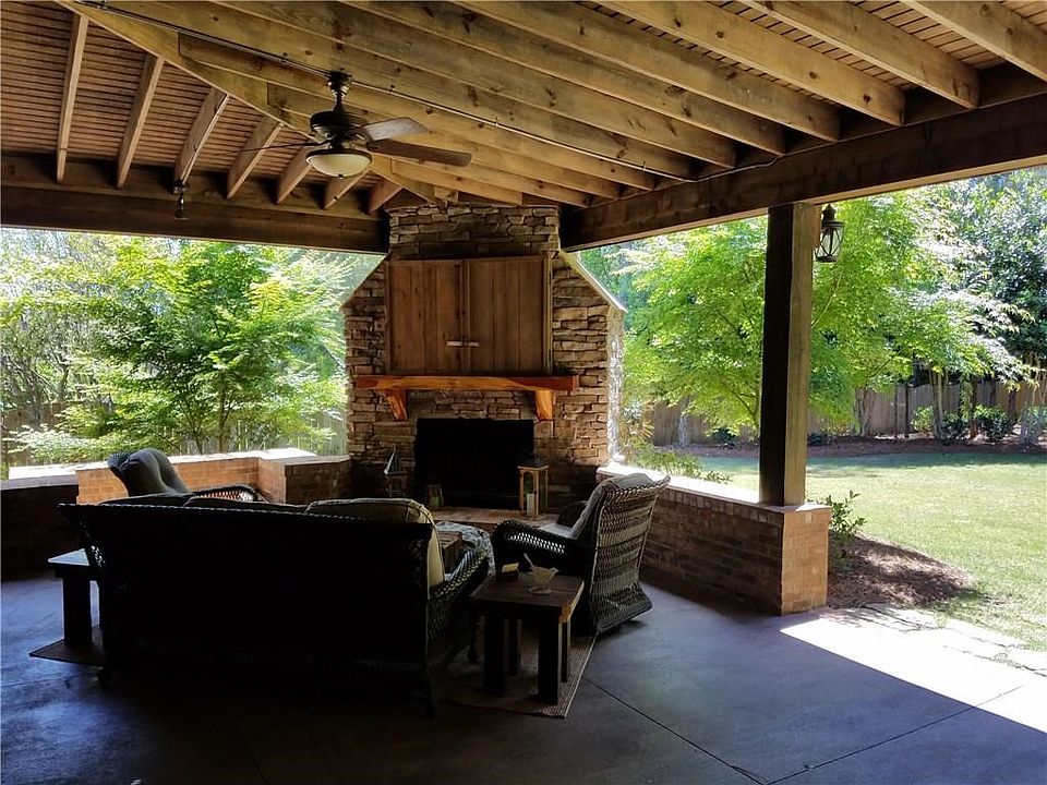 The Most Incredible back yard in Asheton Lakes by Far!  They yard is FLAT, beautifully landscaped, & completely fenced in!