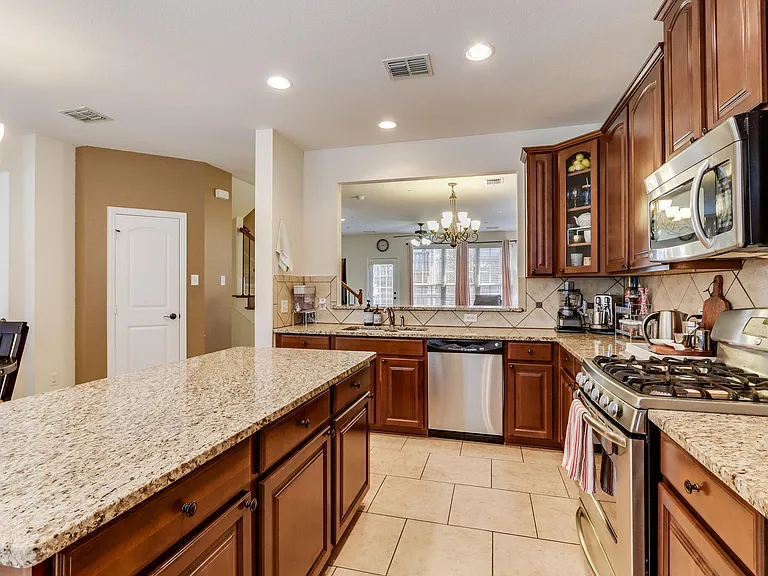 Kitchen looks into living room