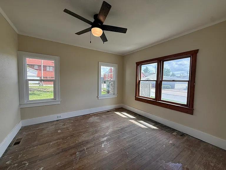 BR1 - downstairs. Hardwood floors are being refinished.