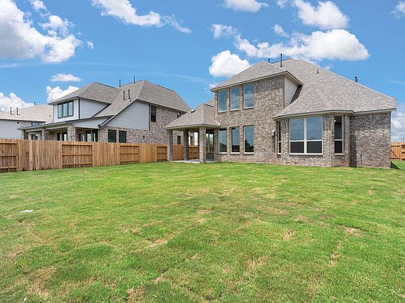 Come and see this spacious backyard with its beautiful covered patio.