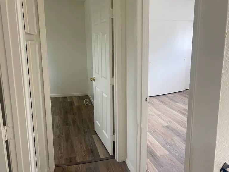 Upstairs hallway, Linen closet to the left, Master bedroom on the right, second bedroom in-between.