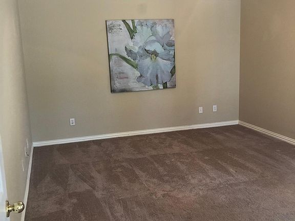 Spacious master bedroom large for king size bed.