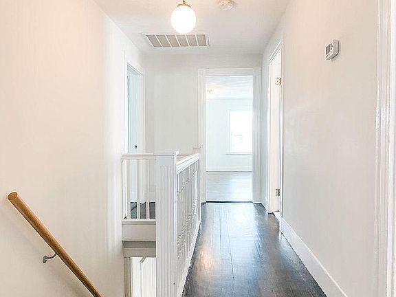 Second floor hallway to three bedrooms, bathroom, and laundry room